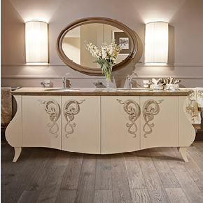 _Glamour bathroom cabinet 
                 in wood, cameo crackle finish, cat. B, with Suite handle 
                 in dove grey silver leaf finish, cat. C, decorated glass top 
                 in dove grey silver leaf cat. C, round single hole faucets
                <br>
                _Orlando mirror 
                 in wood, gloss plum lacquer finish, cat. A.
                <br>
                _Alì wall lamp
                 with pleated lampshade in fabric, cat. A.
                <br>
                _Bathroom accessories
                
