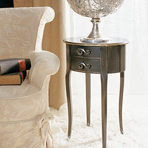 _Ovalino wooden night table 
     ebony finish with rosy silver oxide
      leaf details, cat. B.