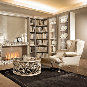 _Brera modular CORNER wooden unit,
                 greige finish, cat. B, central compartment 
                 with bio-ethanol fireplace, Pitti frame 
                 in champagne silver leaf finish, cat. C,
                central compartment back panel in macramé 
                finish with bronze mirror glass shelf
                <br>
                _Maiorca armchairs<br>
                _Medea coffee table 
                 with base in dove grey silver leaf finish, cat. C, 
                 glass top with Fiori decoration